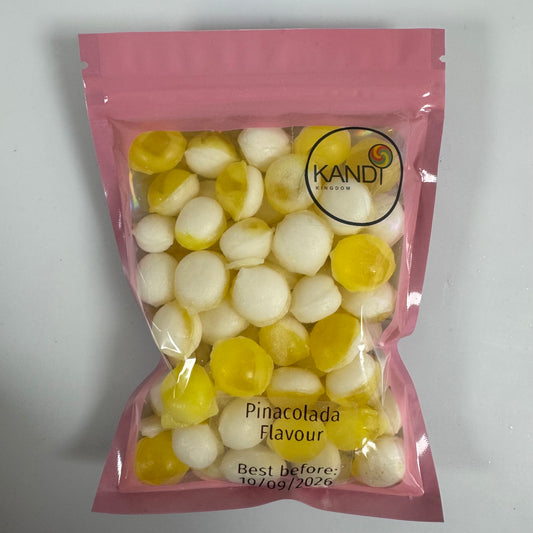 Pink package of Kandi Kingdom handmade Pinacolada flavoured candy on a white background