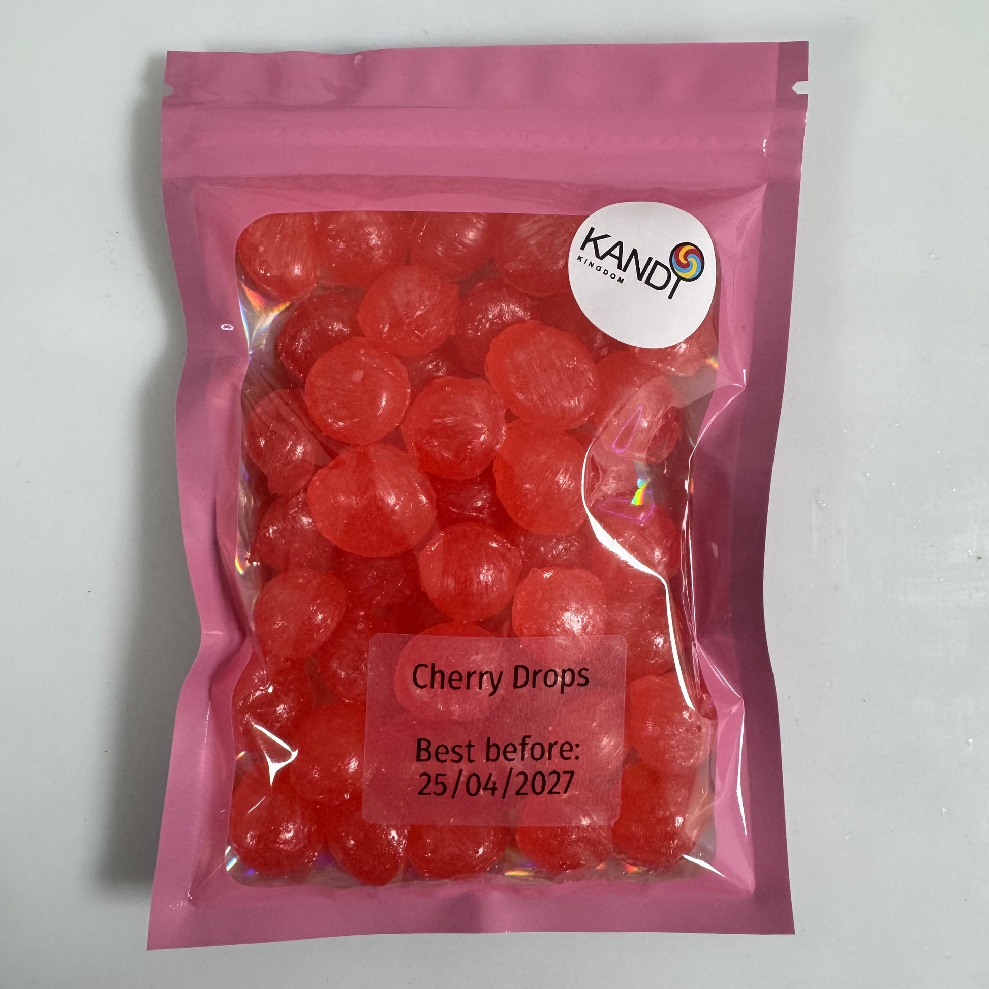 Pink package of cherry drops with Kandy Club logo on a white background