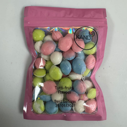 Pink bag of multicolored candies with 'Kandi' branding on a white background