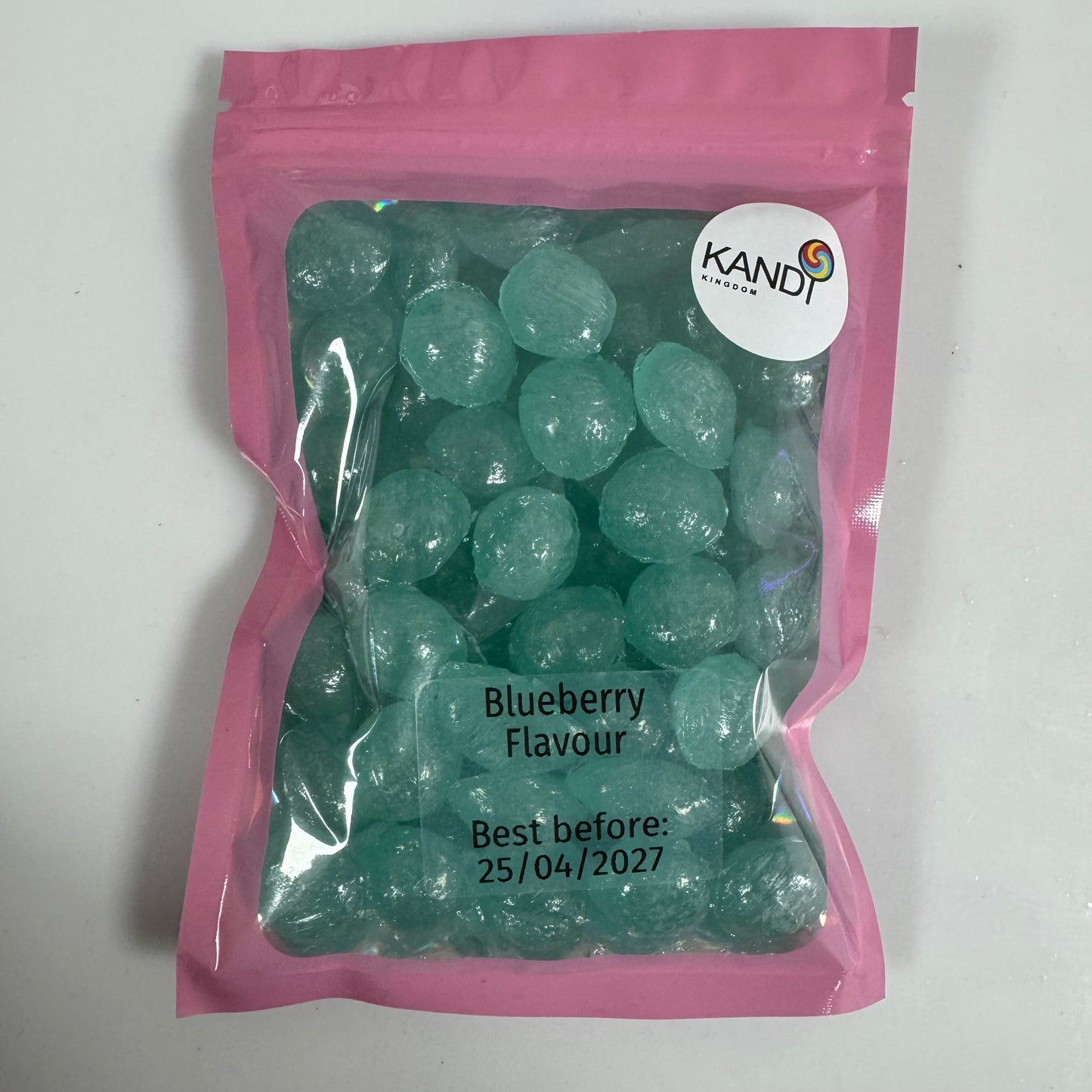 Bag of blueberry-flavored candies with Kandi Kingdom label on a white background